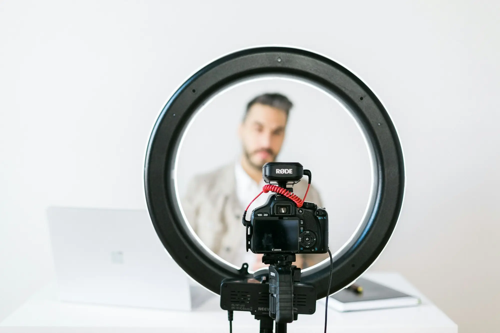 Content creator's ring light and phone set up on a tripod