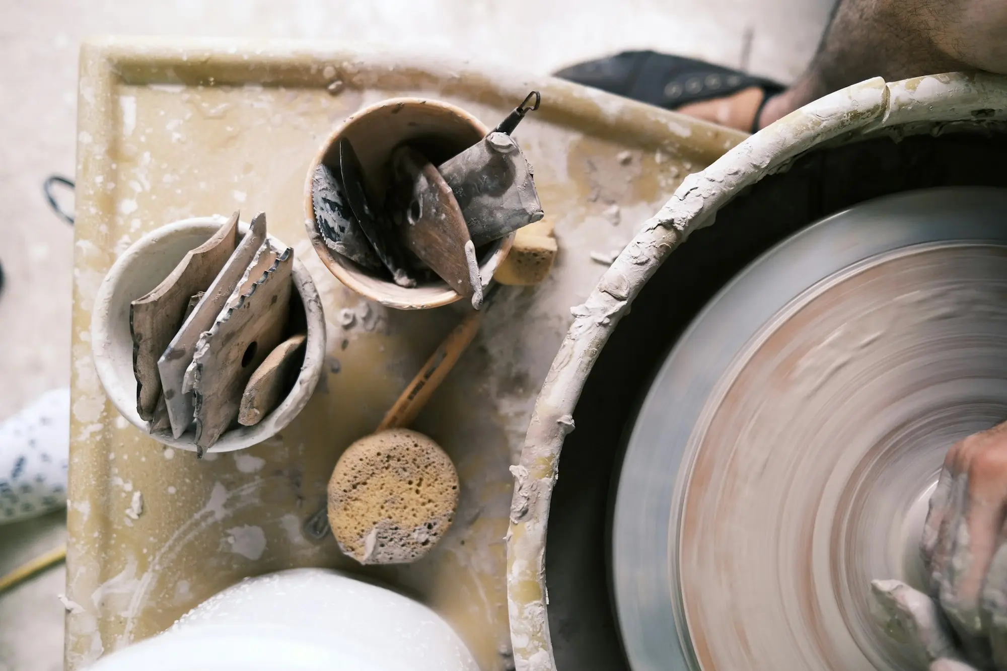 Maker's workbench with hand tools and a grinding wheel