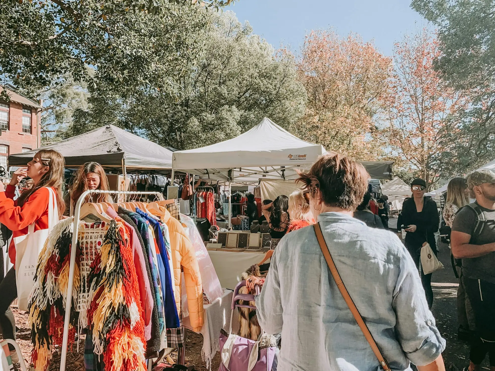 Weekend market stalls with clothing racks in Glebe, Sydney